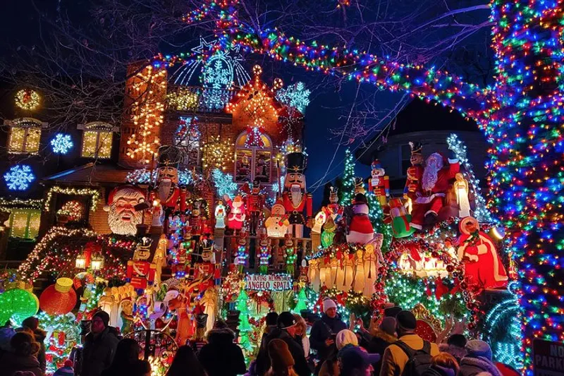 Heated coach on a Dyker Heights Christmas lights New York bus tour parked in Brooklyn with groups walking among decorated houses