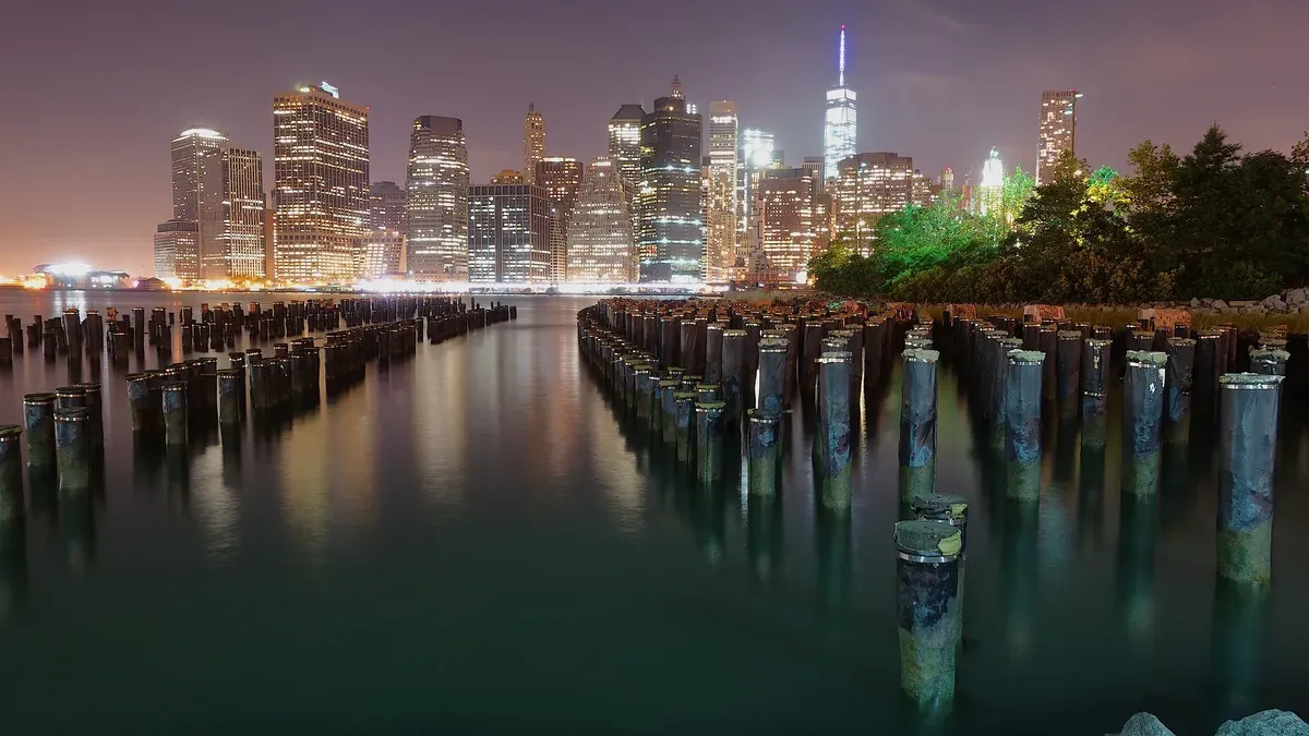 The Lower Manhattan skyline at night from the old piers in Brooklyn, the view NYC night bus tours stop for